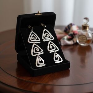 Elegant Silver Spiral Clip On Earrings